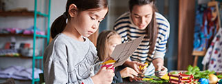 A pupil cutting paper in art class 