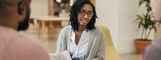 Person sitting and looking at somebody