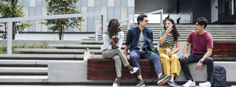 Students chatting outside a school